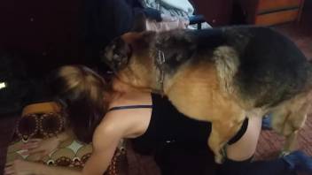 Beauty in black getting fucked on all fours by a dog
