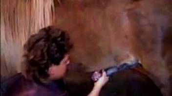 Leather-clad mature woman banging sexy creatures in the stable