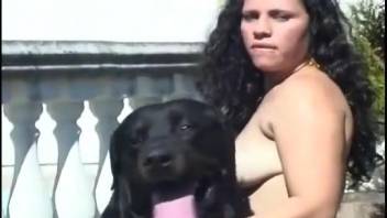 Artistic outdoor bestiality encounter with a black canine