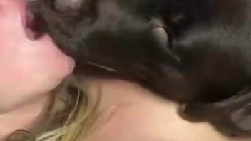Delightful blonde is begging to get fucked by a black dog