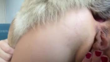 Attractive mature woman pushes large canine penis into her rear opening