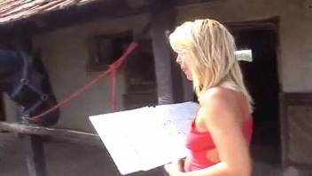 Blonde in red outfit banged by a well-hung stallion