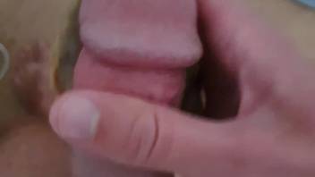 Hot scenes of this guy masturbating with a massive snail on his cock