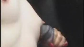 Ginger babe blowing a huge black horse dick